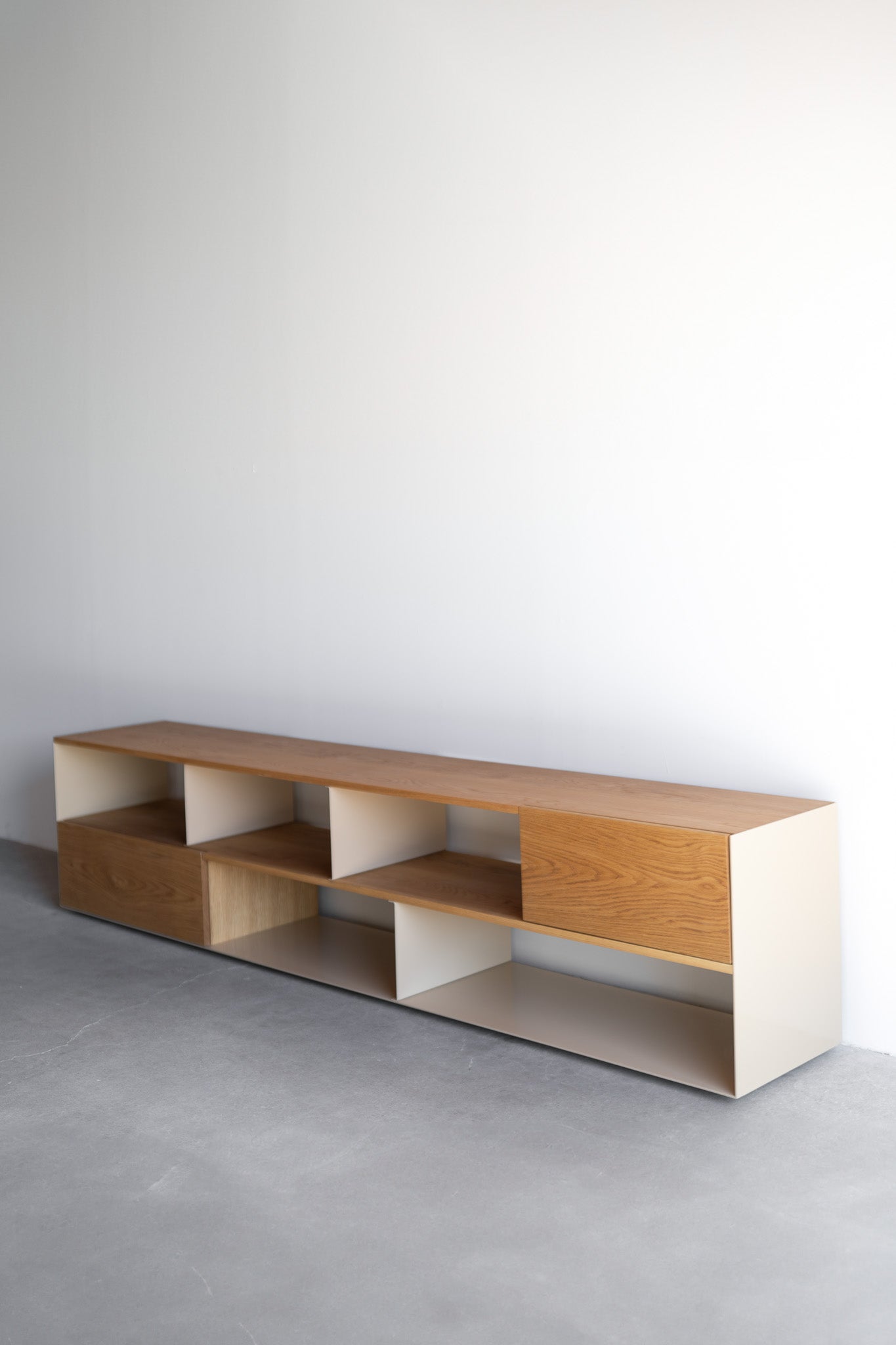 Side shot of low wood and metal bookcase