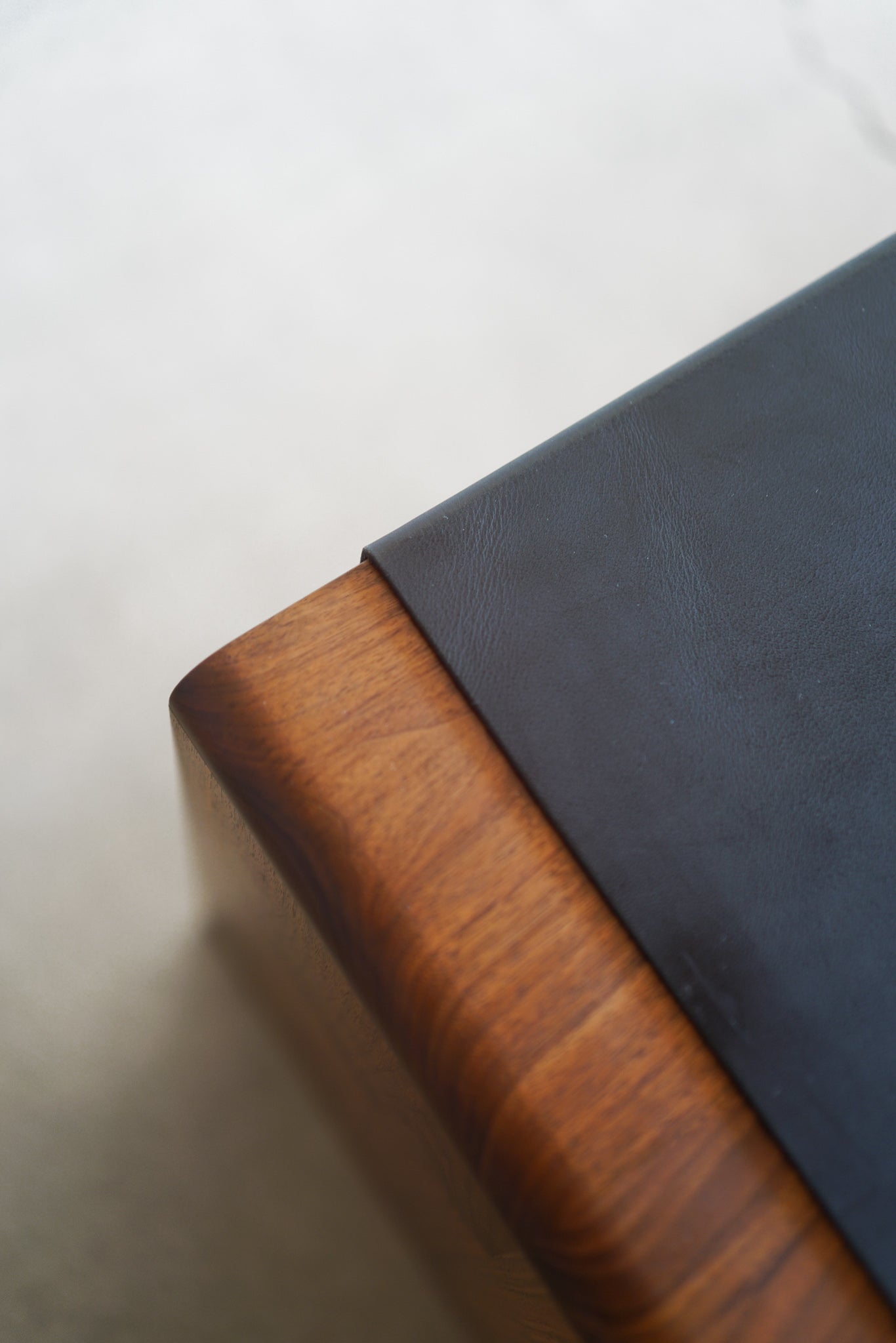 Carter storage cabinet - top shot of leather and wood details