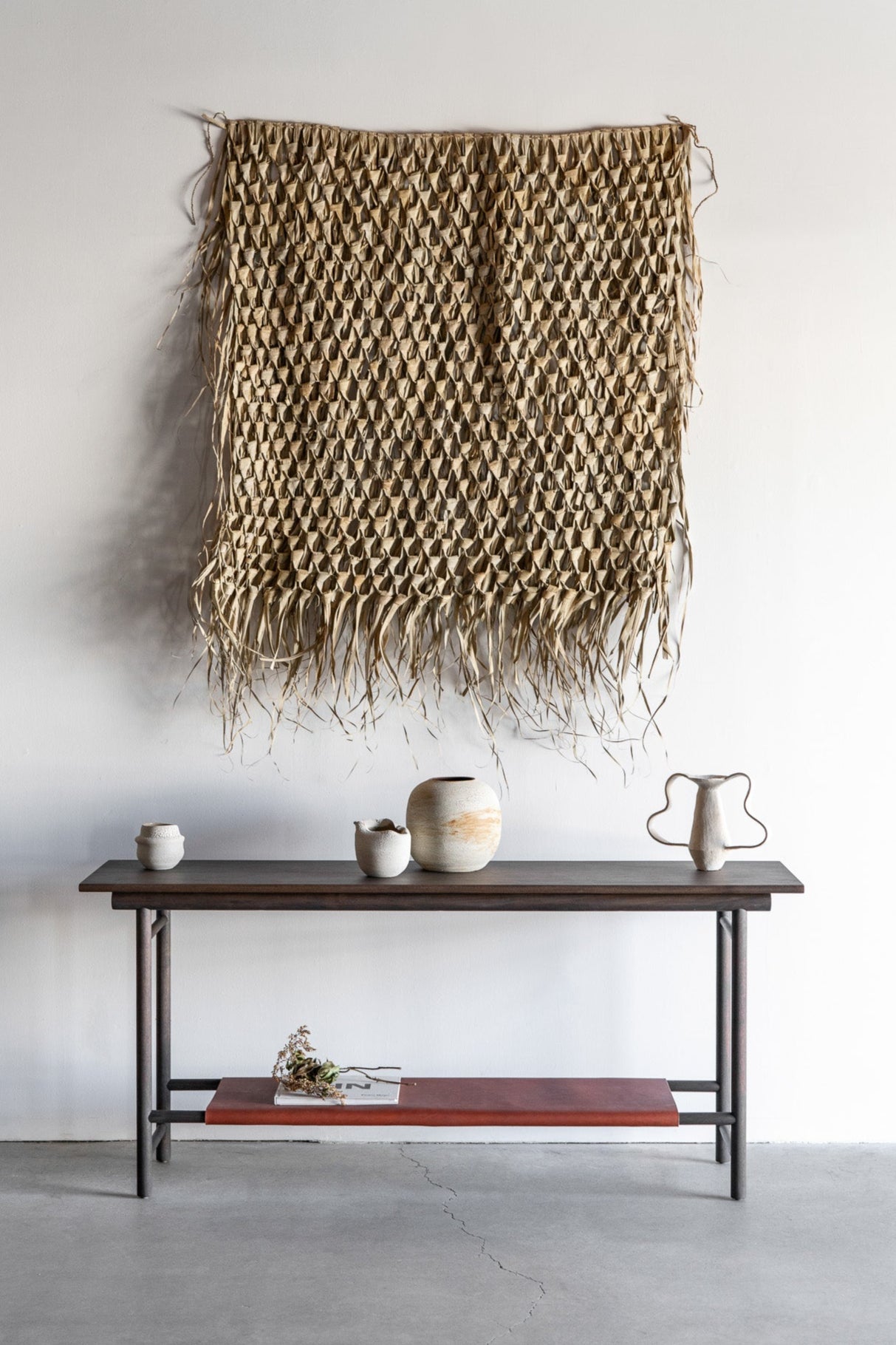 Reyes console- solid walnut, structural leather shelf