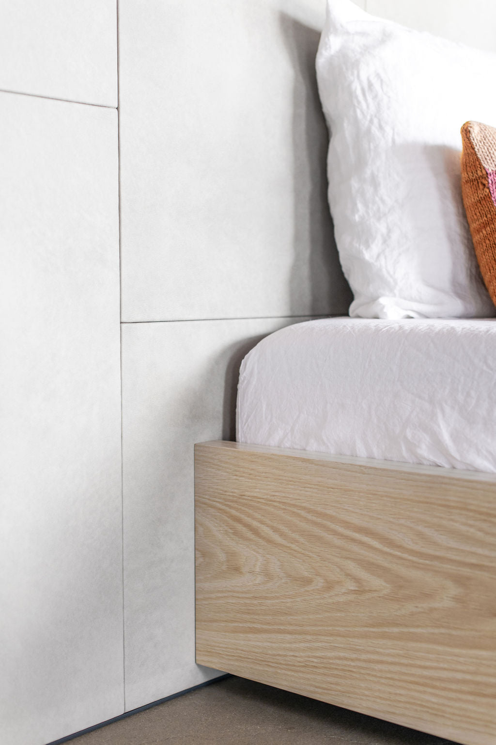 leather headboard and wood base close up