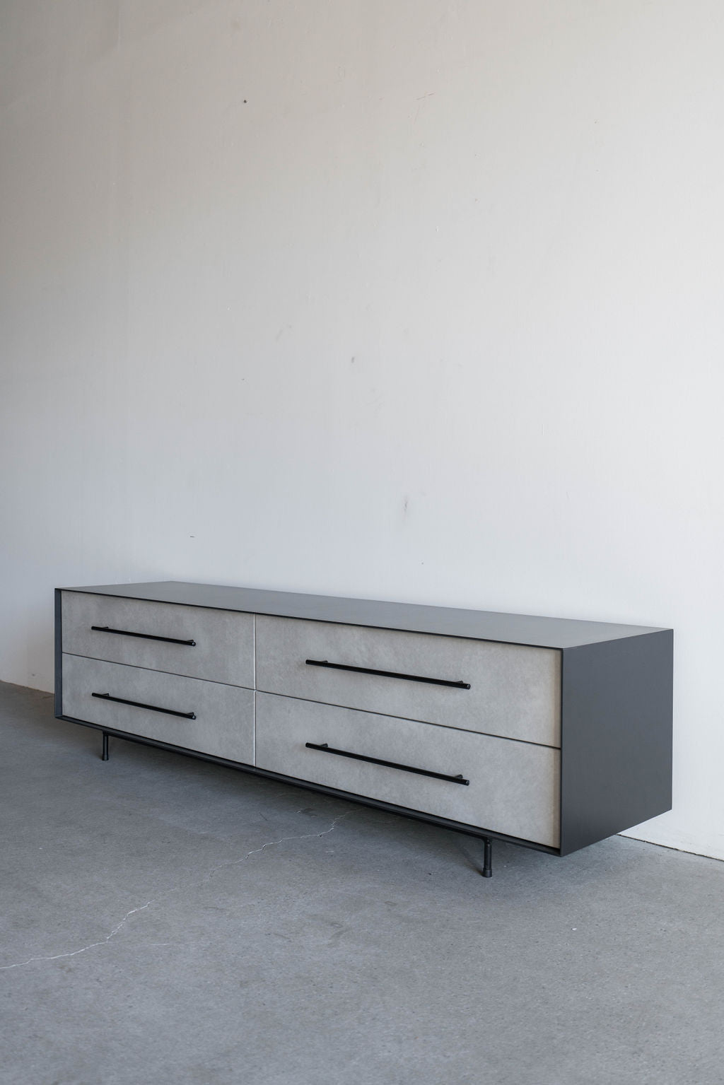 Right view shot of steel casing console with leather face