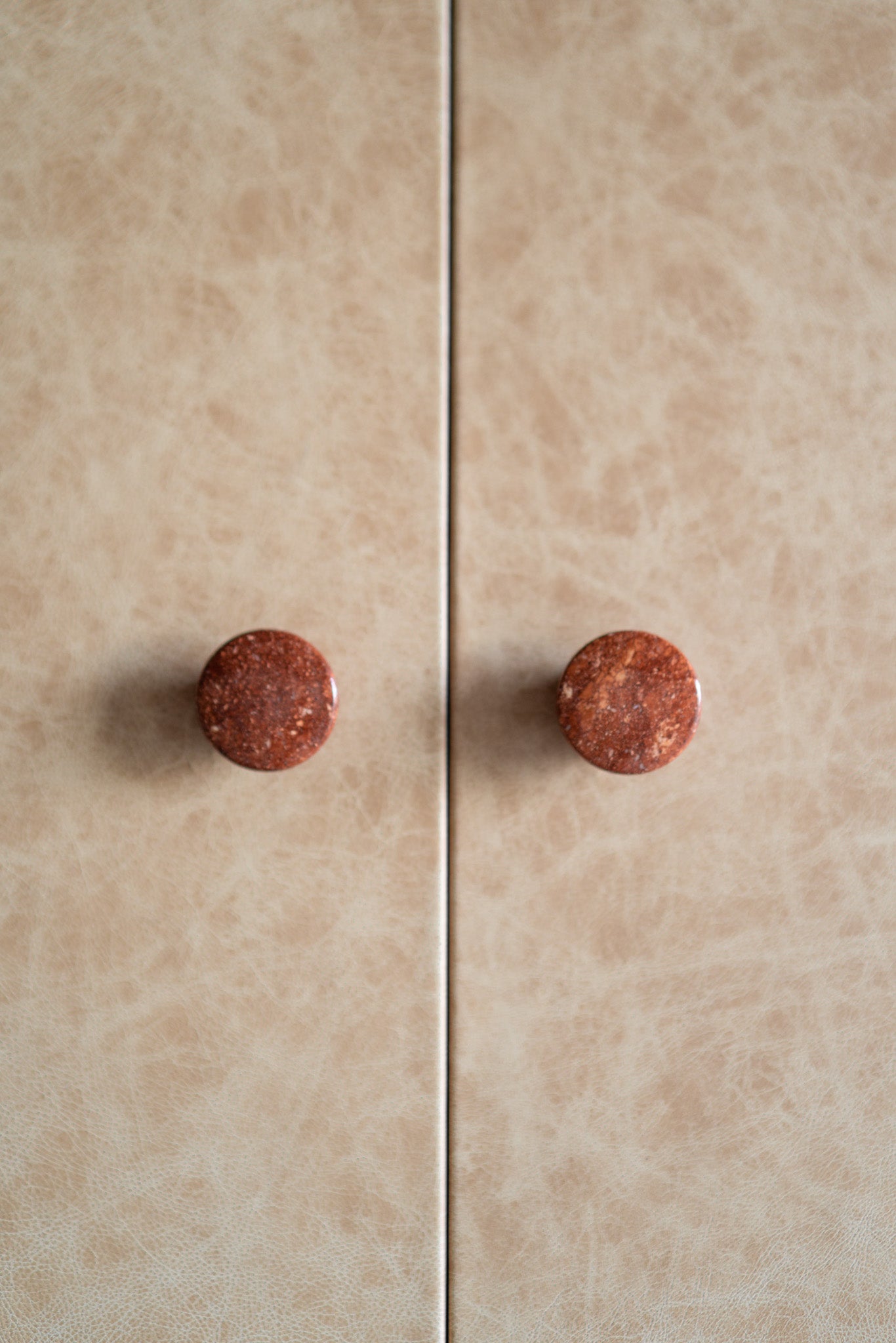 Carter Armoire- close up on leather door, specialty stone knobs