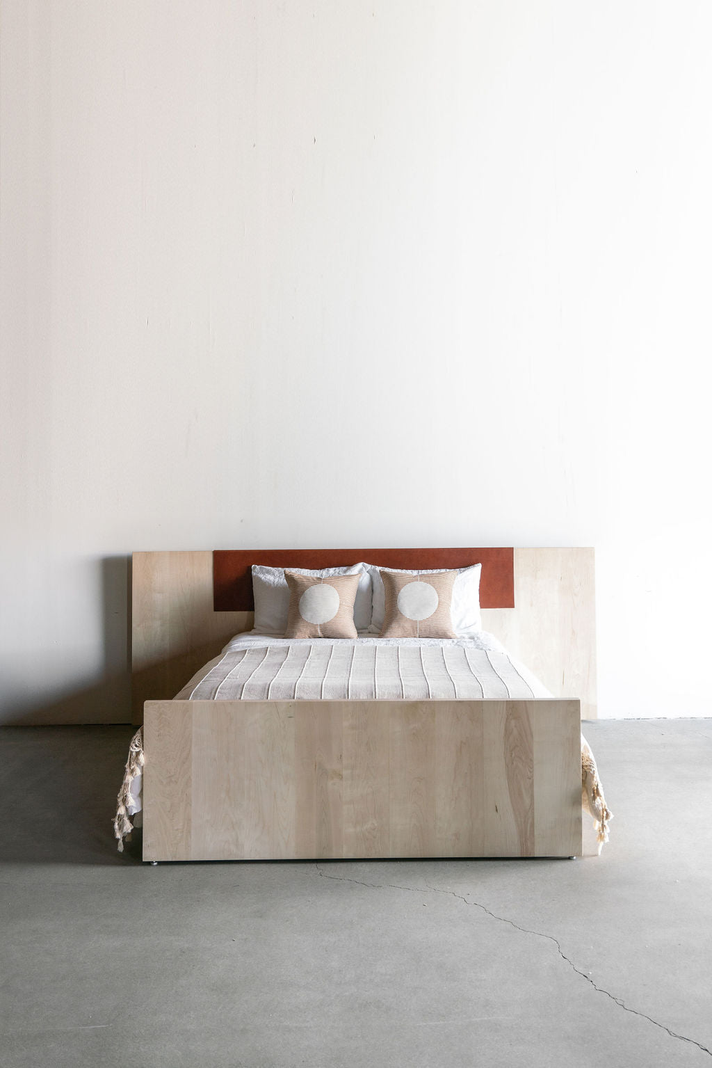 Carter bed- full shot, all wooden bed frame with leather on backboard