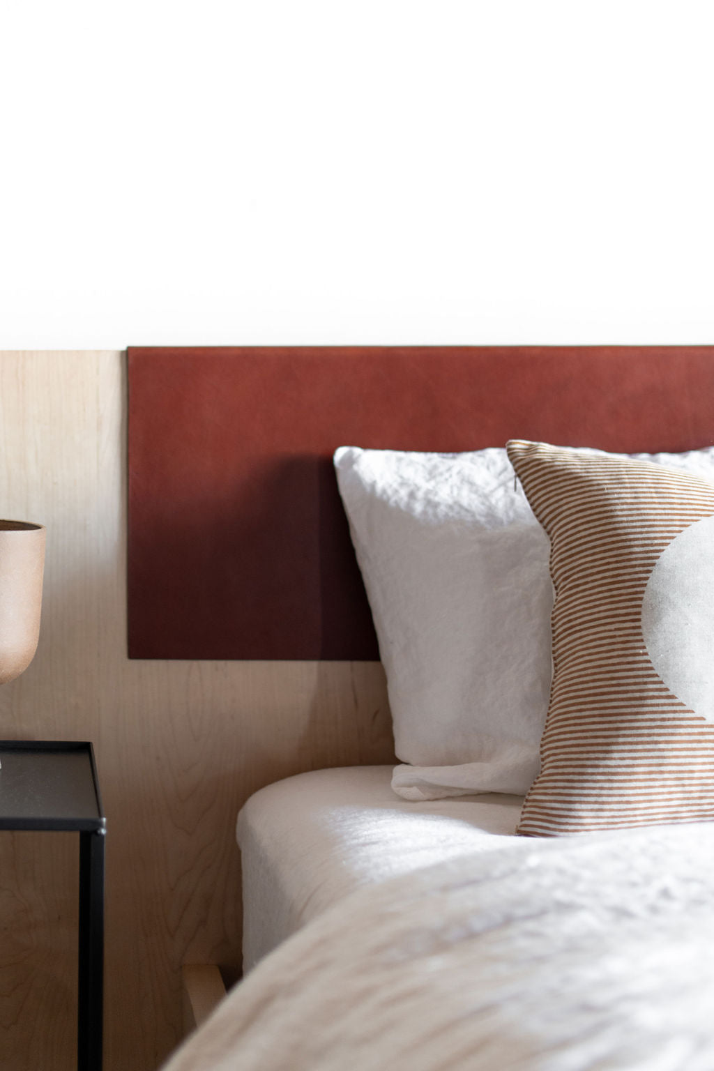 Zoomed in shot of headboard with leather detail