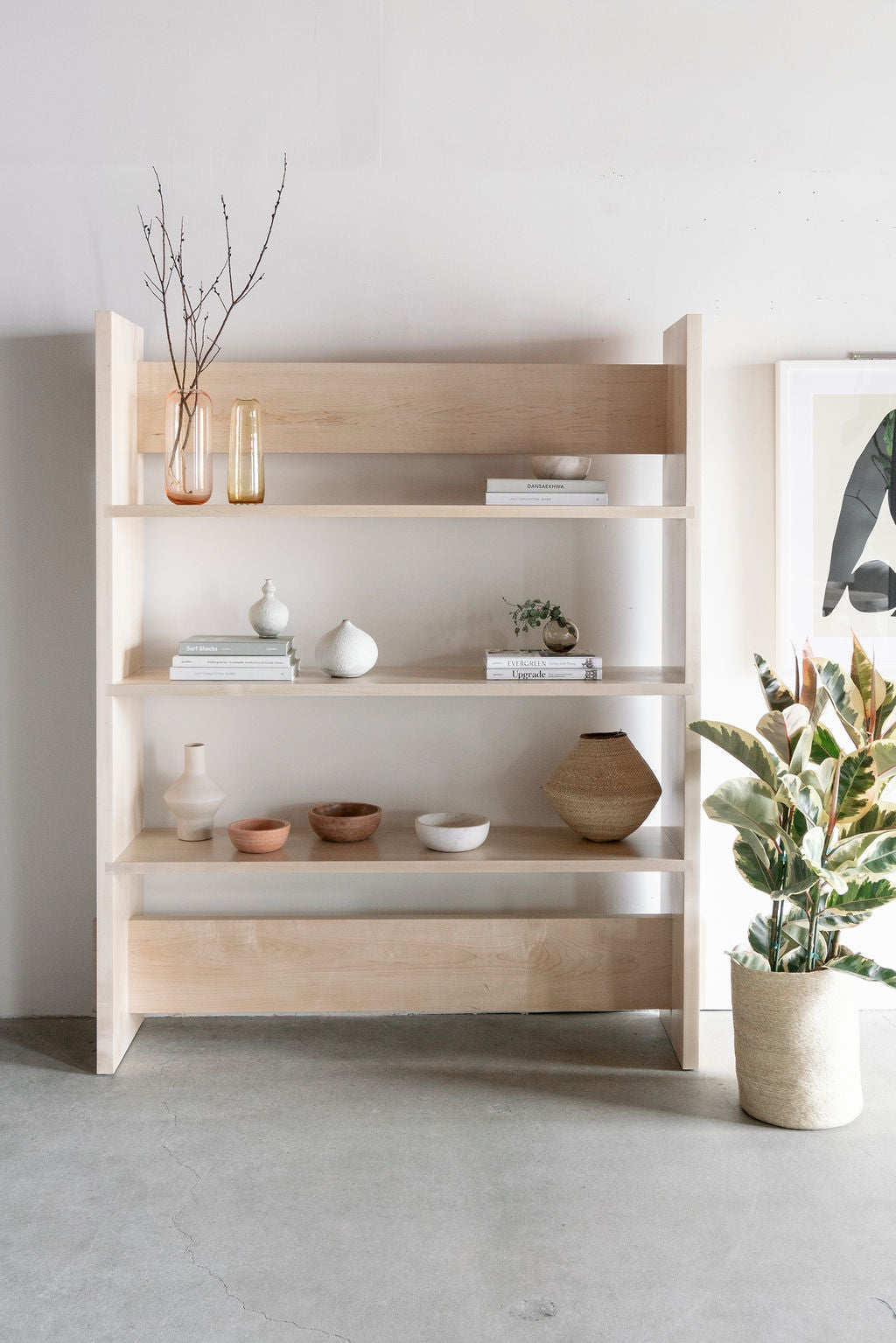 Carter Bookcase- Full shot of all wood bookcase, styled