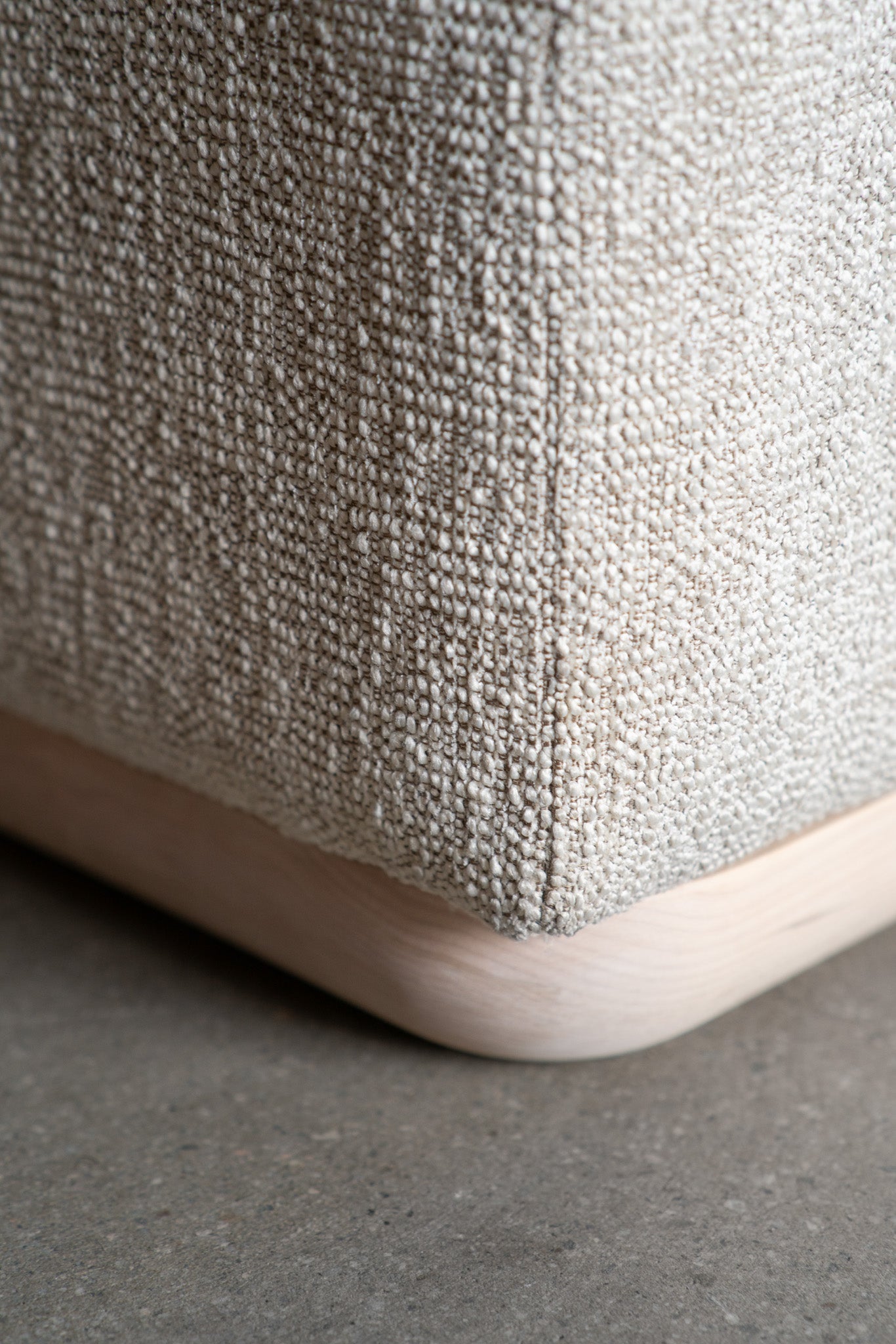 close up on sofa corner with wood