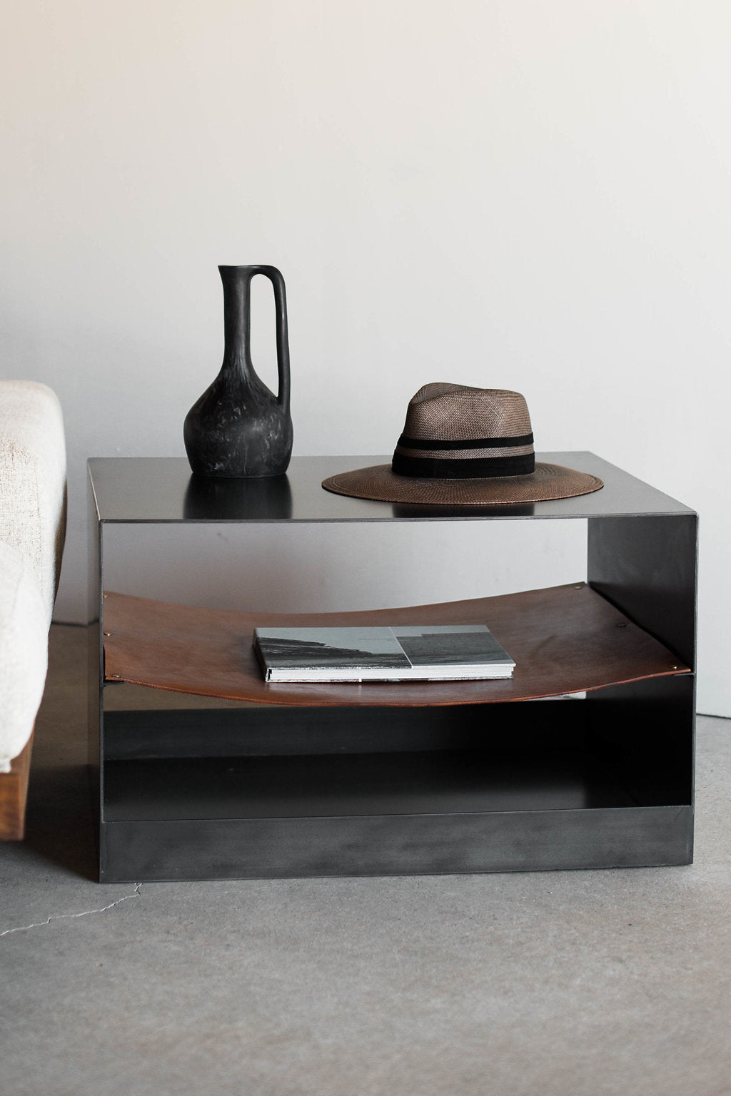 Latigo side table- close up shot, styled