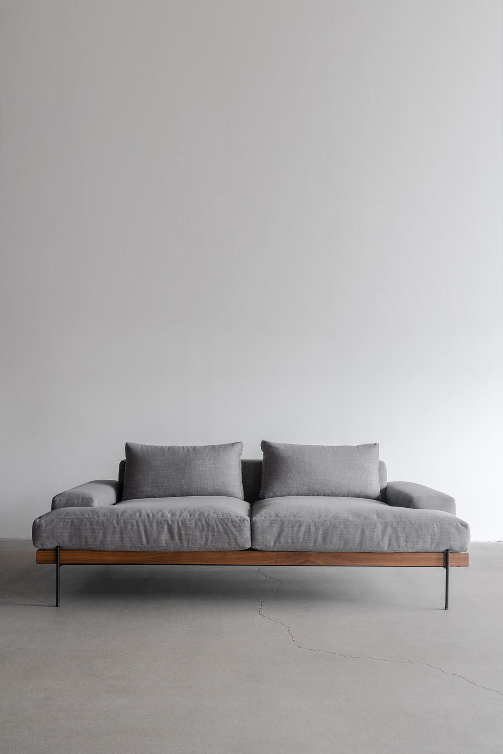 Rivera sofa- wood frame, steel legs and upholstered cushions